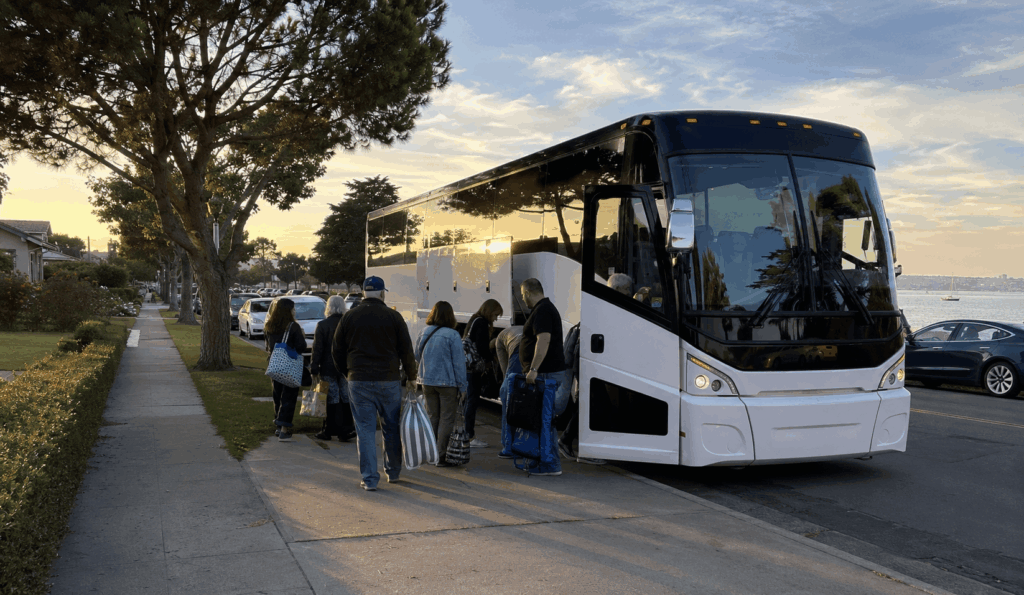 concert group boarding a charter bus in alameda for a trip to shoreline amphitheatre