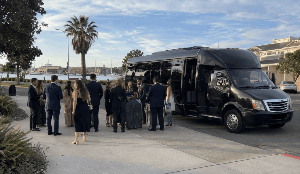 minibus picking up a mid-size group near an alameda waterfront venue for a bay area wedding shuttle