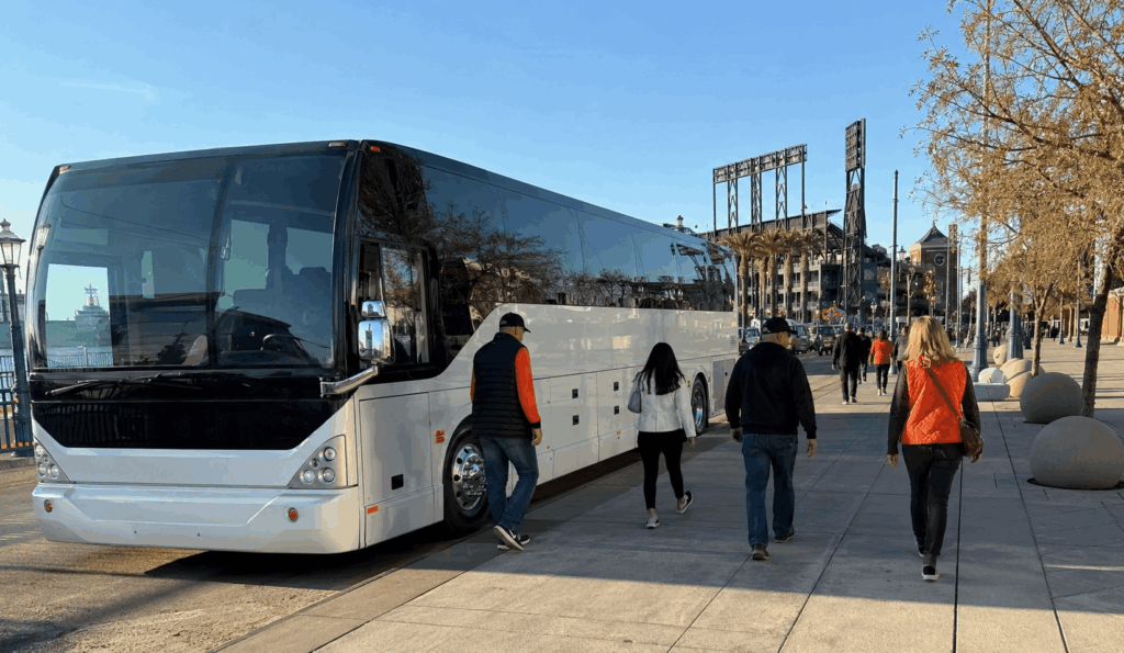 charter bus dropping off giants fans near oracle park in san francisco’s mission bay