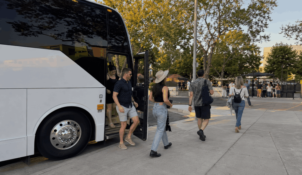 charter bus dropping off a group near the napa valley expo entrance for bottlerock napa valley