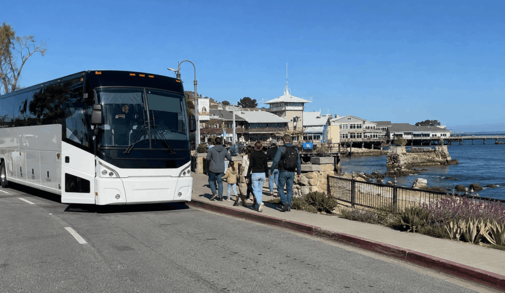 charter bus bringing a group to carmel-by-the-sea for an afternoon stop on a monterey day trip