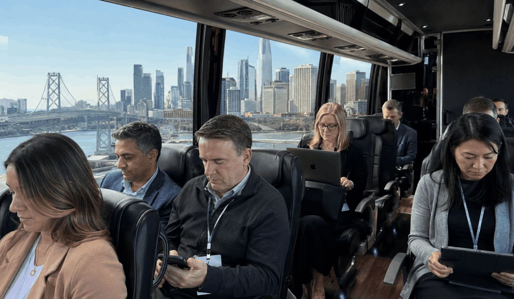 conference attendees boarding a charter shuttle outside a bay area hotel before heading to moscone center