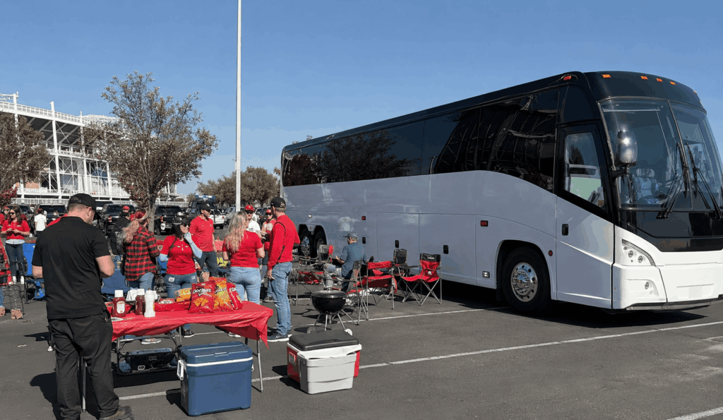 group reboarding a charter bus near levi’s stadium after a game or concert in santa clara