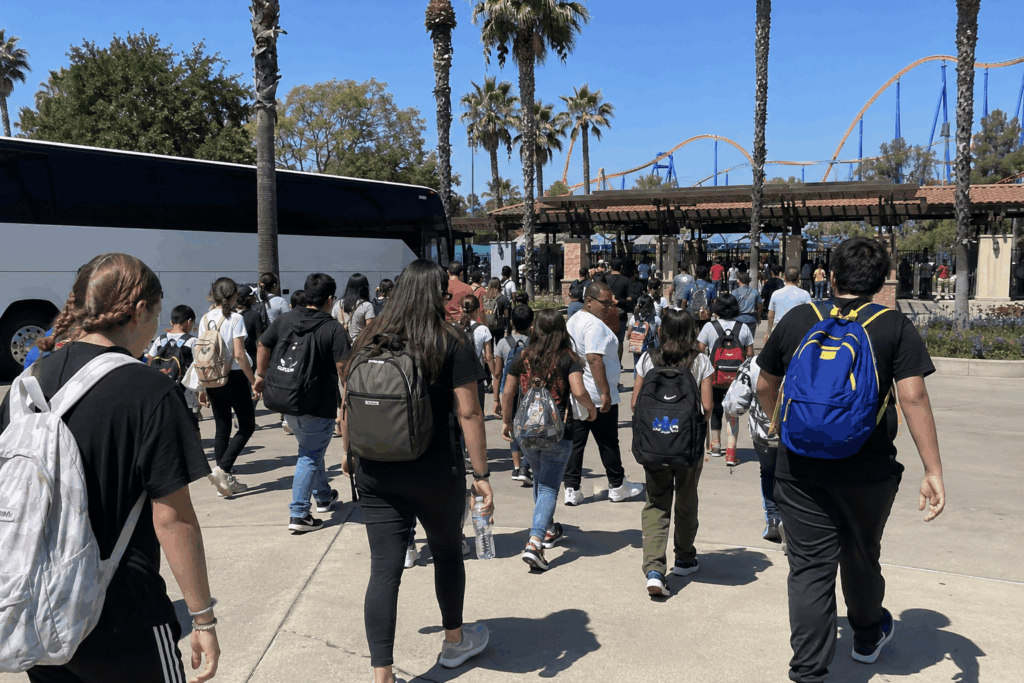  families and students returning to a charter bus after a full day at six flags discovery kingdom in vallejo