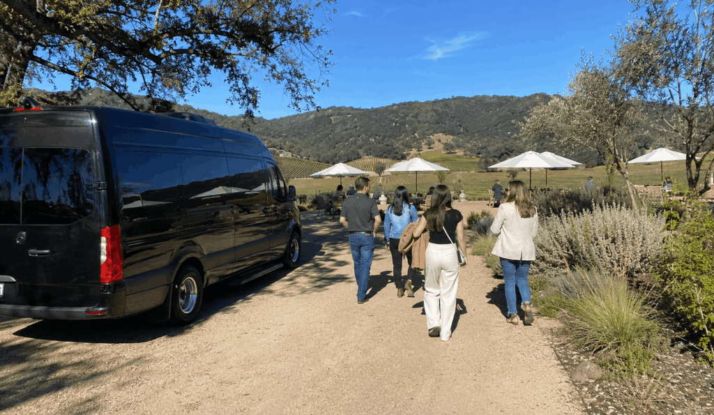 group arriving by shuttle at a sonoma valley winery with vineyard views near glen ellen