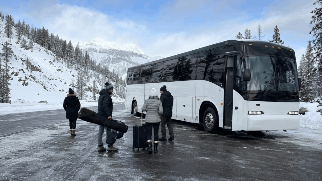 charter bus traveling through snowy sierra mountain conditions on the way to lake tahoe